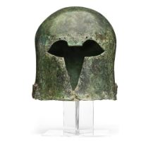 A Greek bronze Corinthian helmet