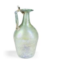 A Roman green glass jug