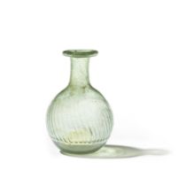 A Gallo-Roman green glass ribbed bottle