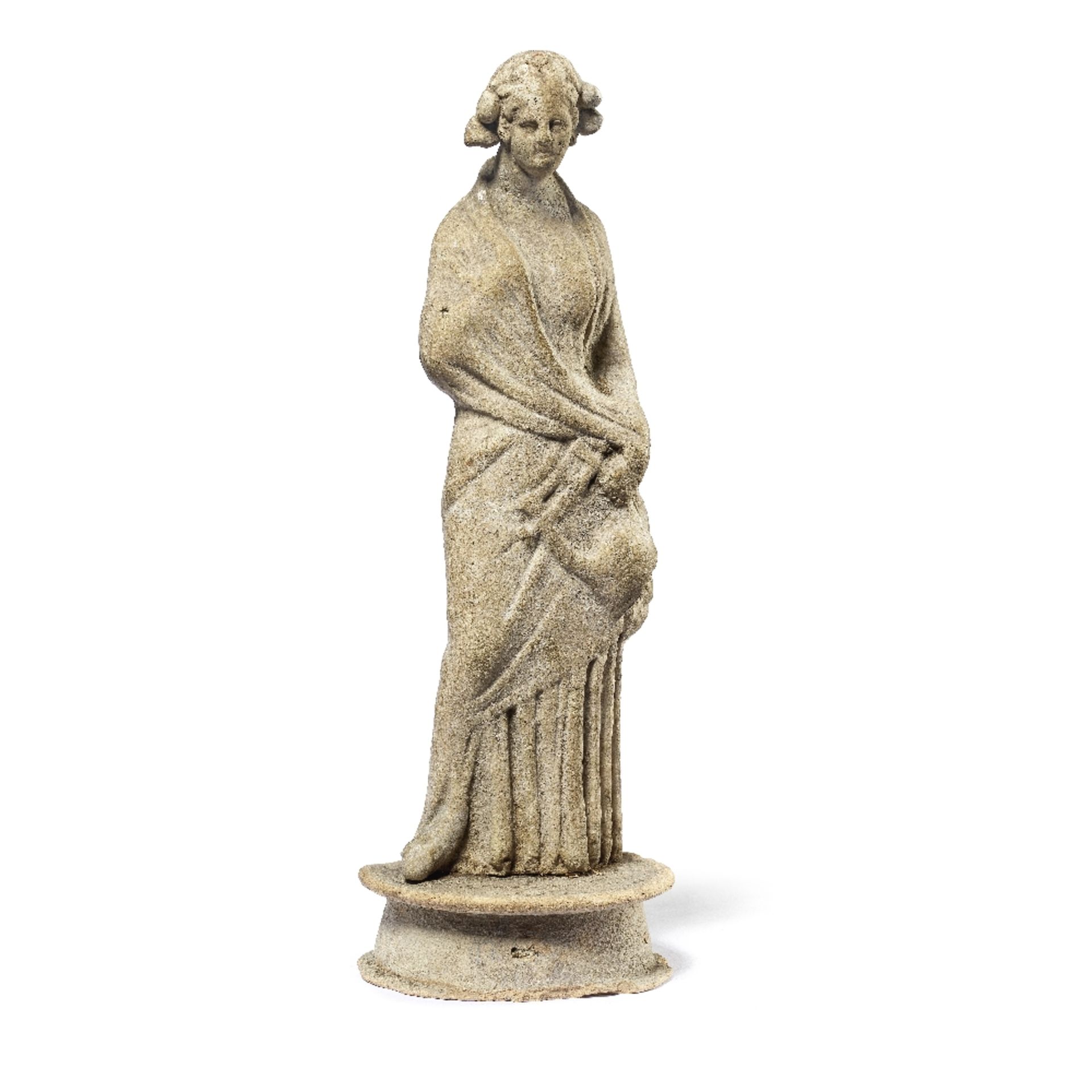 A Greek terracotta standing female holding a lyre
