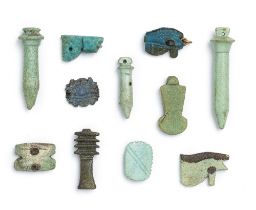 Eleven Egyptian glazed faience amulets of protective symbols 11