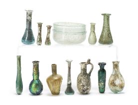 Twelve Roman glass bottles and a Roman glass bowl 13