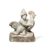 A Greek terracotta boy and cockerel