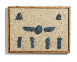 A framed group of Egyptian blue glazed faience amulets 9