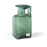 A Gallo-Roman green glass square-sided jug