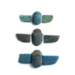 An Egyptian turquoise glazed faience winged scarab, and two scarabs with unmatched wings 7
