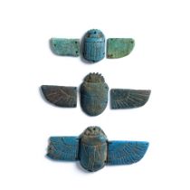 An Egyptian turquoise glazed faience winged scarab, and two scarabs with unmatched wings 7