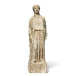 An Attic terracotta standing female figure