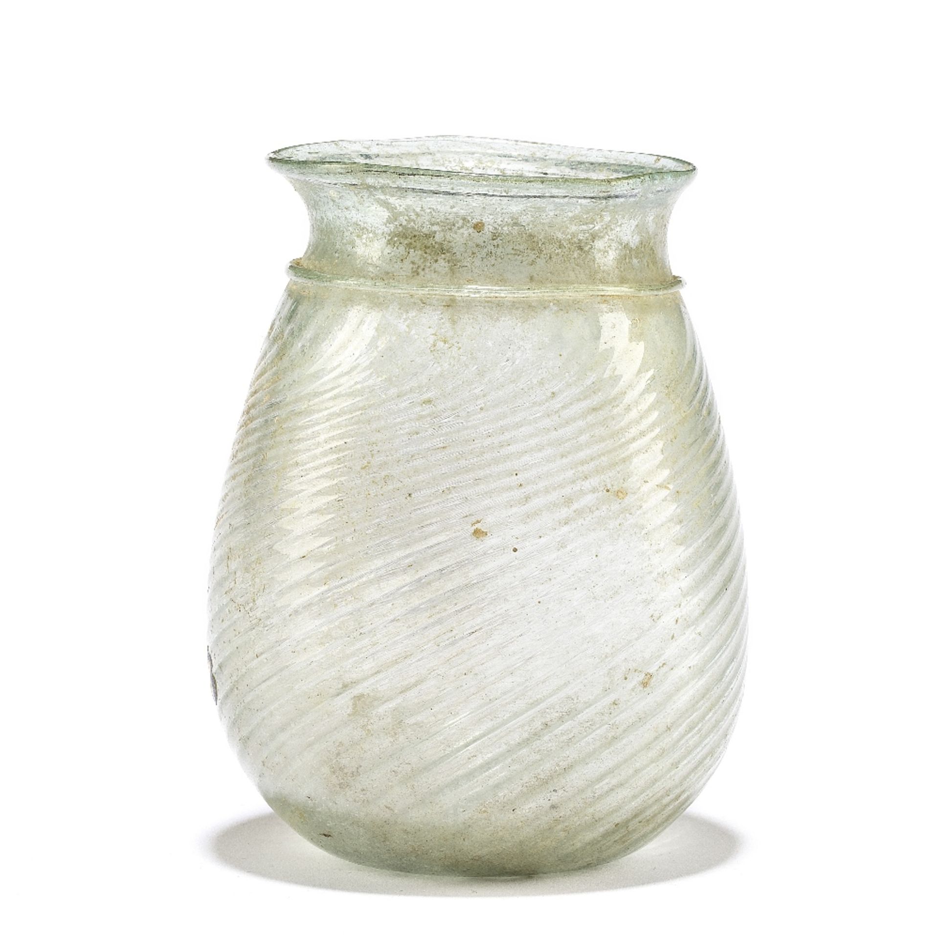 A Roman pale blue ribbed glass beaker