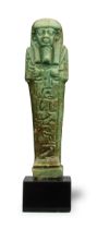 An Egyptian green glazed faience shabti for Ta-Shert-Hor