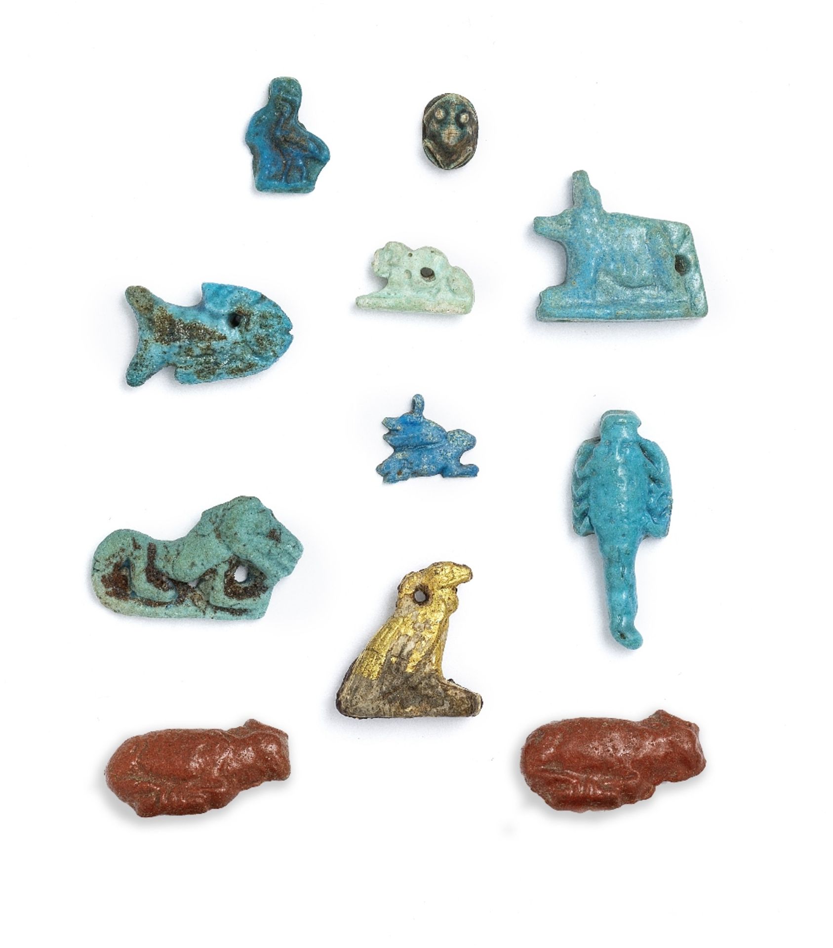 Ten small Egyptian faience animal amulets and a gilt wood vulture amulet 11