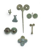 Six European bronze dress ornaments and a Luristan bronze pin 7