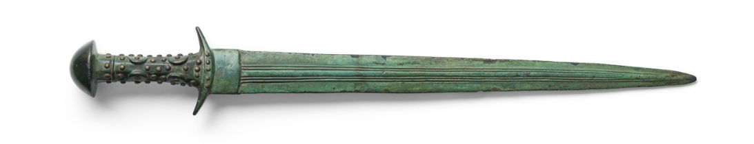 A Luristan bronze sword with silver studded hilt