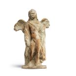 A Greek terracotta standing Eros