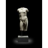 A Roman marble torso of a nude male youth