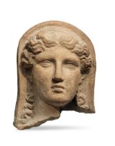 An Etruscan terracotta votive veiled female head