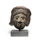 A Romano-Egyptian plaster funerary female head