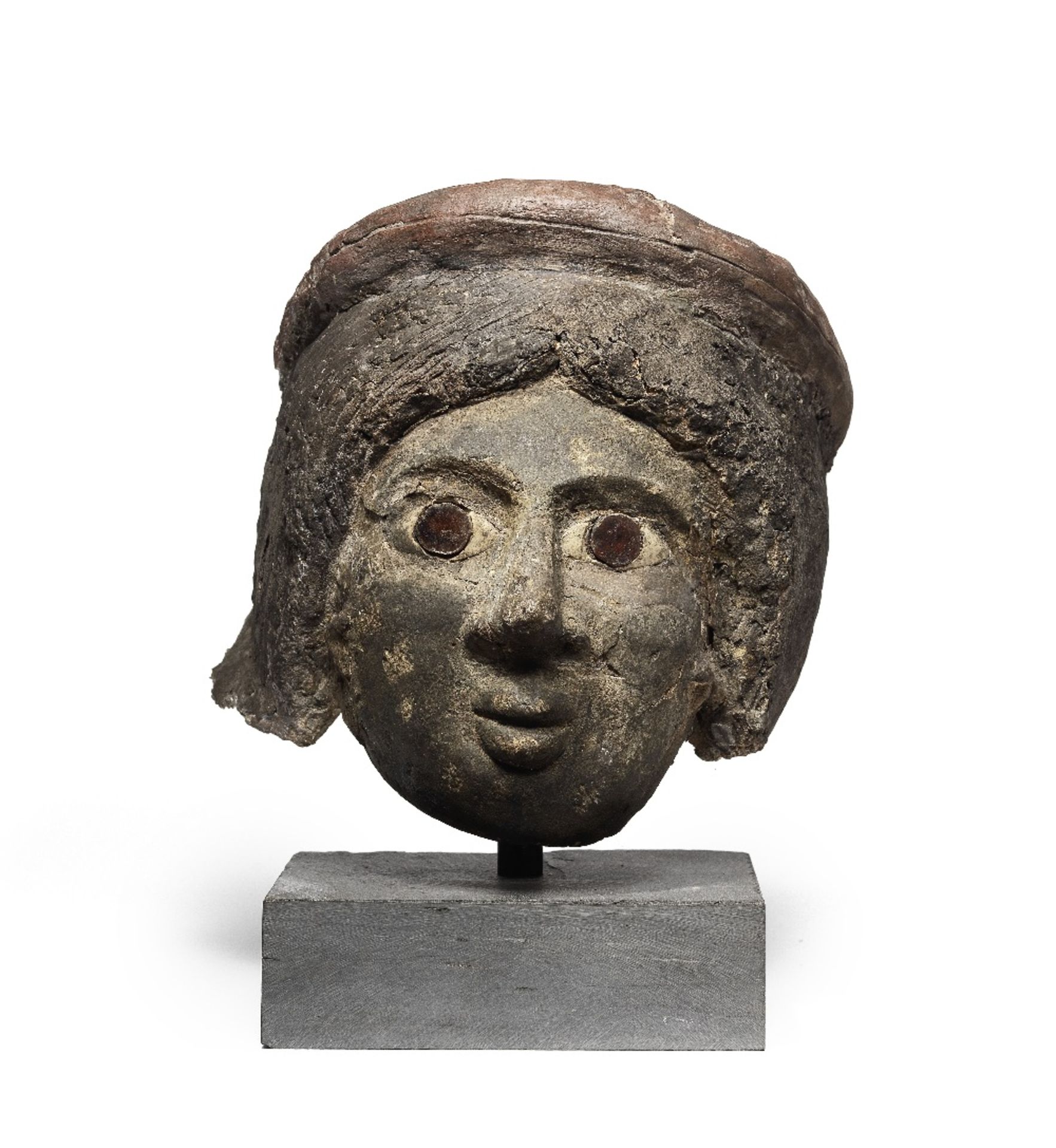 A Romano-Egyptian plaster funerary female head