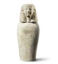 An Egyptian limestone canopic jar of human-headed Imsety