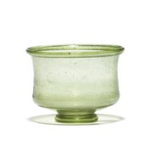 A Gallo-Roman green glass footed bowl