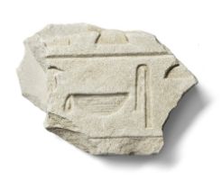 An Egyptian limestone relief fragment with hieroglyphs