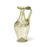 A large Roman yellow-green glass jug