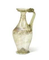 A large Roman yellow-green glass jug