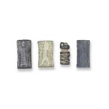 An Old Babylonian black stone cylinder seal, an Old Babylonian haematite cylinder seal, an Akkad...