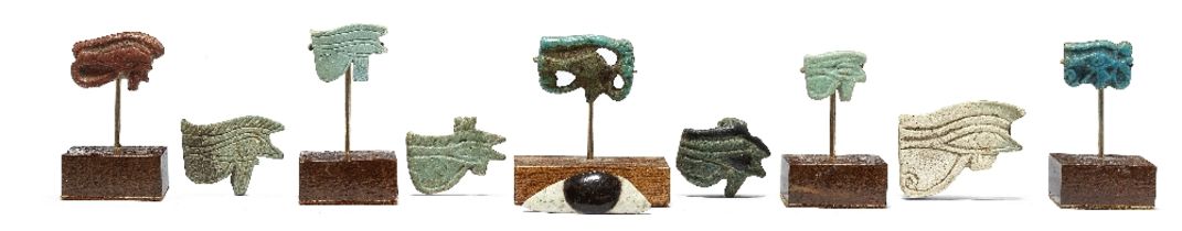 Nine Egyptian wedjat eye amulets and a faience eye inlay 10