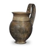 An Etruscan bucchero ware olpe