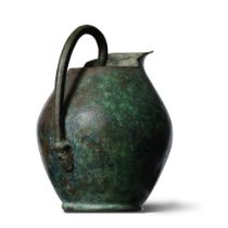 An Etruscan bronze oinochoe with Archeloos handle terminal