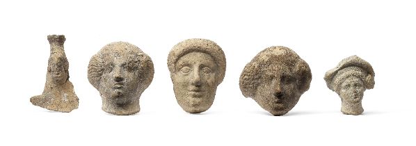 Three Greek terracotta female protome heads, a Boeotian fragmentary bust, and a Tarrentine head ...