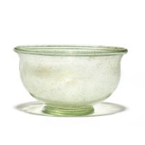 A Gallo-Roman green glass footed bowl