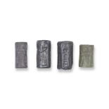 Three Old Babylonian haematite cylinder seals and an Akkadian green stone cylinder seal 4