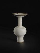 LUCIE RIE (1902-1995) Bottle vase with flaring lip, circa 1985Stoneware, matt white glaze with g...