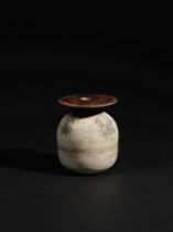 HANS COPER (1920-1981) Ovoid pot with disc, circa 1965Stoneware, layered white porcelain slips a...