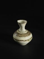 LUCIE RIE (1902-1995) Small vase, circa 1959Stoneware, white glaze, brown manganese speckles com...