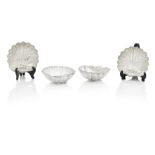 A set of four scallop shell bonbon dishes Probably German, circa 1900, indecipherable maker's m...