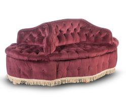 A late 19th early 20th century conversation sofa