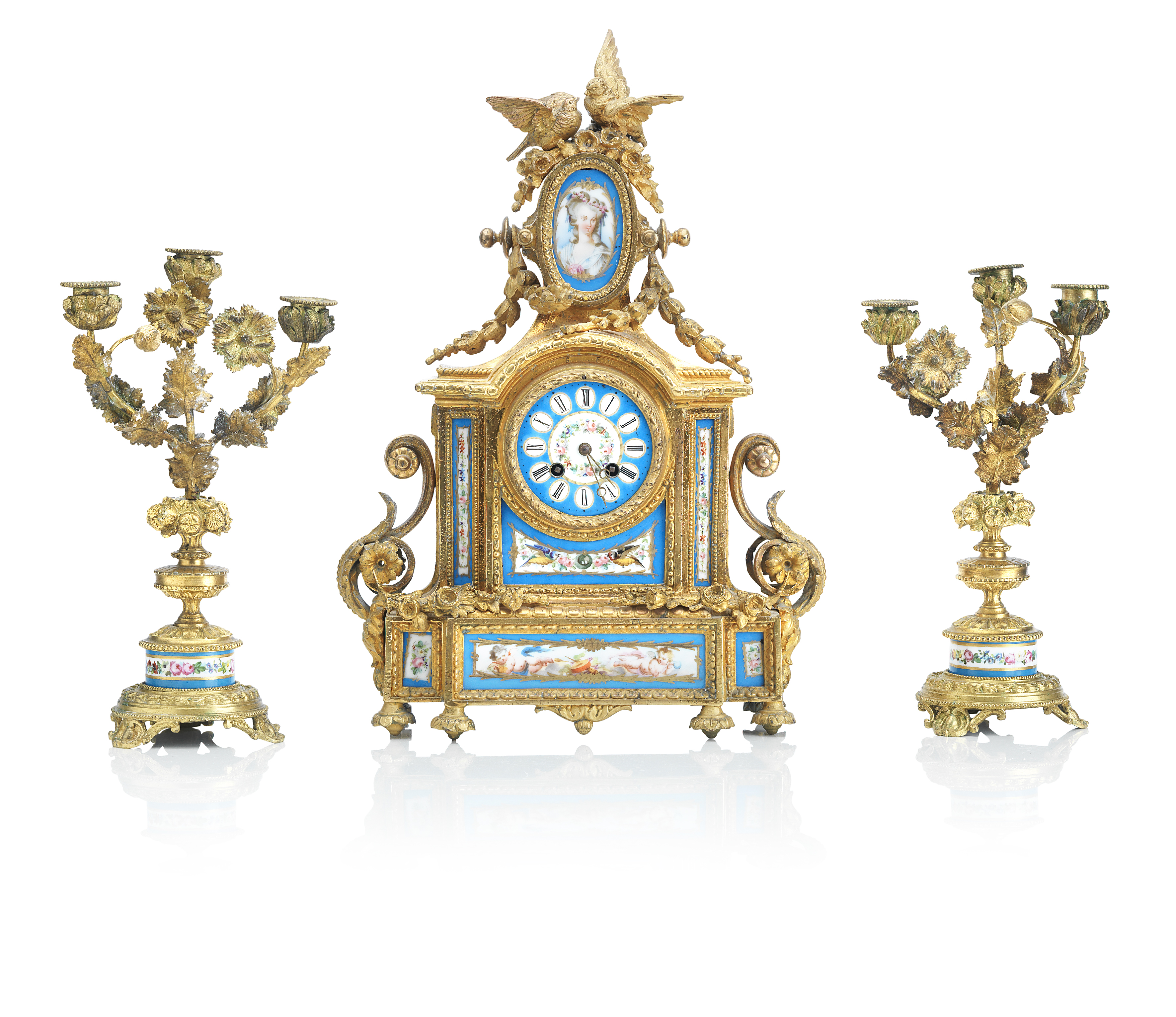 A 19th century French Sevres-style porcelain and gilt metal mounted clock garniture