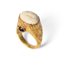 A Near Eastern gold sheet ring with incised banded agate intaglio with a recumbent deer