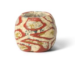 A Roman red, yellow, blue and white mosaic glass bead