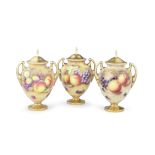 Three Royal Worcester 'Painted Fruit' vases and covers by Brian Leaman and Bernard Schwarz, circ...