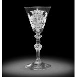 A fine Dutch engraved Royal armorial light baluster wine glass, circa 1750-55