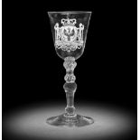 A fine Dutch engraved Royal armorial light baluster wine glass, circa 1767