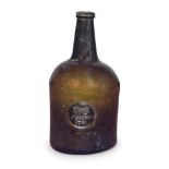 A rare sealed 'Squat Cylinder' wine bottle, dated 1781