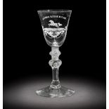 A fine Dutch engraved 'Liberty' light baluster wine glass attributed to Jacob Sang, circa 1760