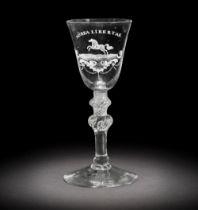 A fine Dutch engraved 'Liberty' light baluster wine glass attributed to Jacob Sang, circa 1760