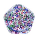 A Clichy faceted close-packed millefiori basket paperweight, circa 1850