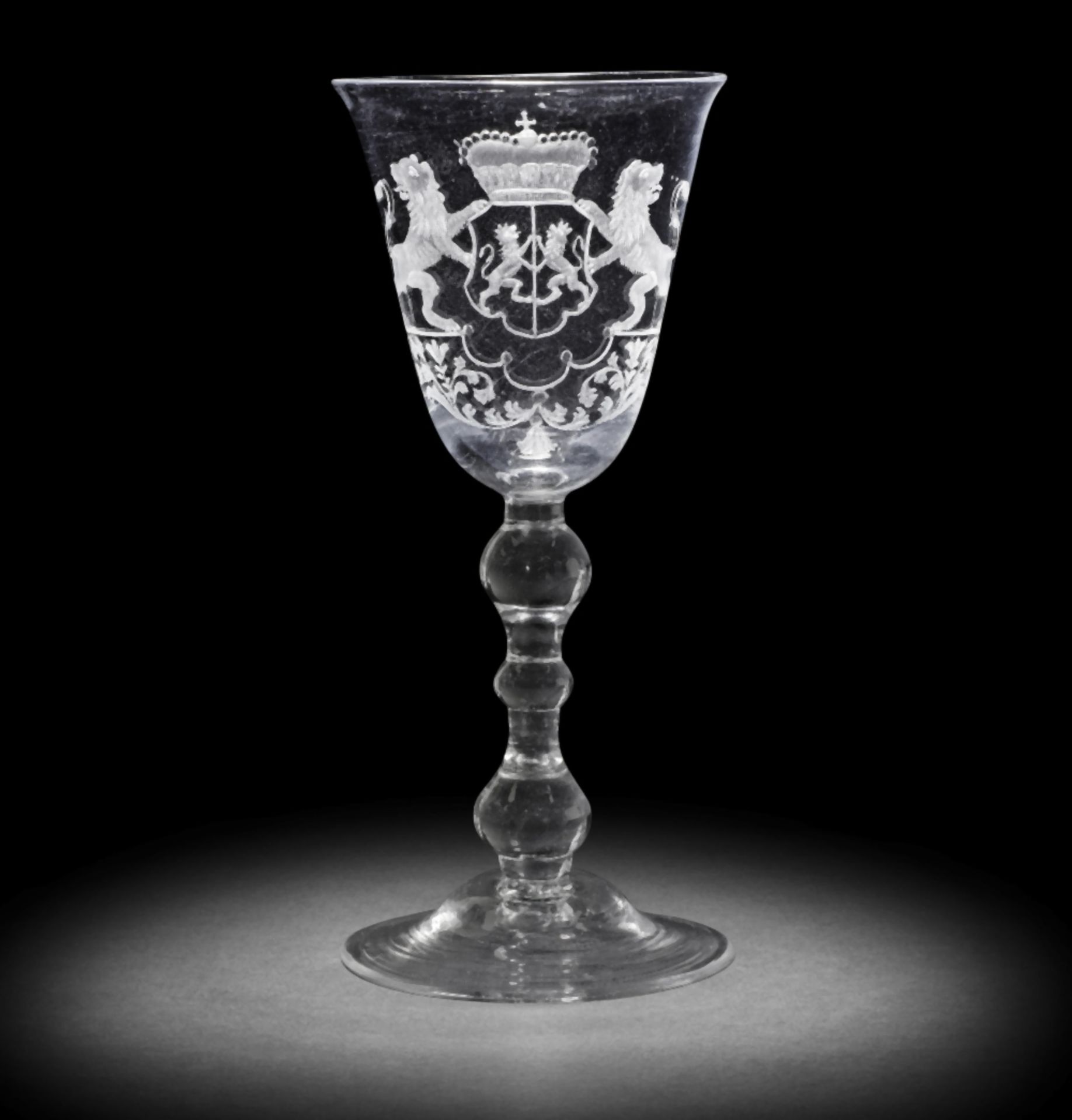 A Dutch engraved armorial light baluster goblet, circa 1750